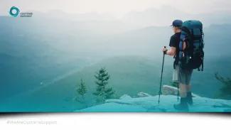 man stood on top of a mountain (life is a journey)